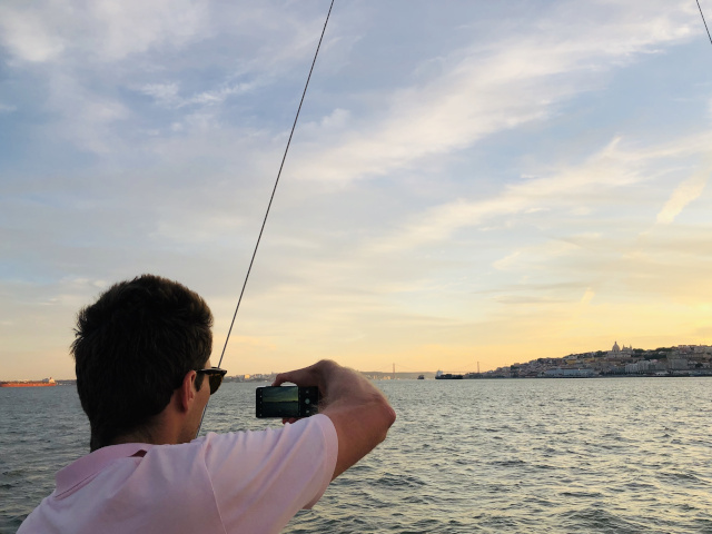 Guests taking pictures at Lisbon sunset